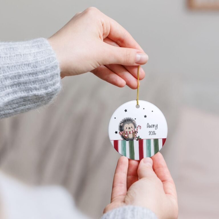 Personalized ornament with a hedgehog in a striped scarf holding a candy cane