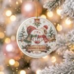 Personalized snowman couple ceramic ornament with names and year hanging on a Christmas tree